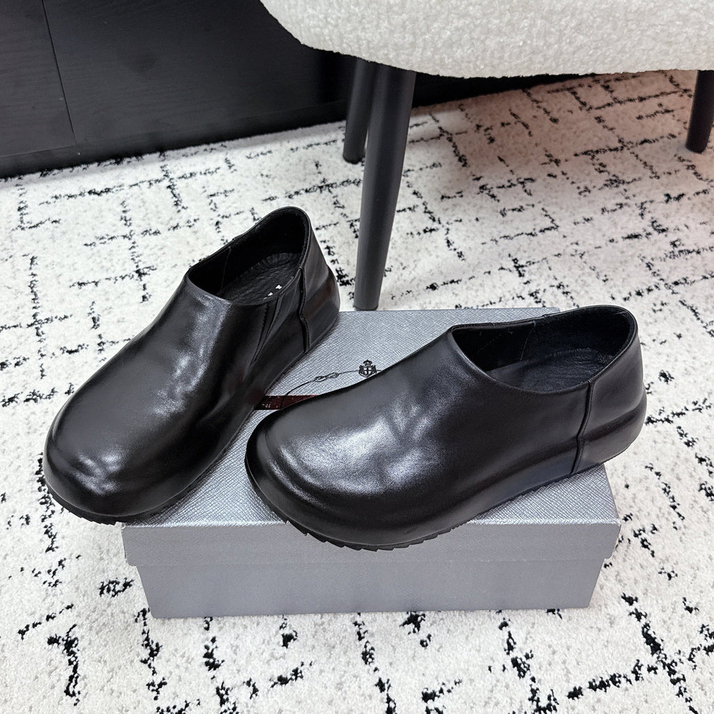 PRADA 26S SLIP ON SHOES IN BLACK SMOOTH CALFSKIN