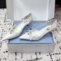 PRADA 26S POINTED-TOE HIGH HEELS 55MM IN WHITE CALFSKIN WITH BOW