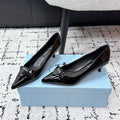 PRADA 26S POINTED-TOE HIGH HEELS 60MM IN BLACK PATENT CALFSKIN WITH LOGO