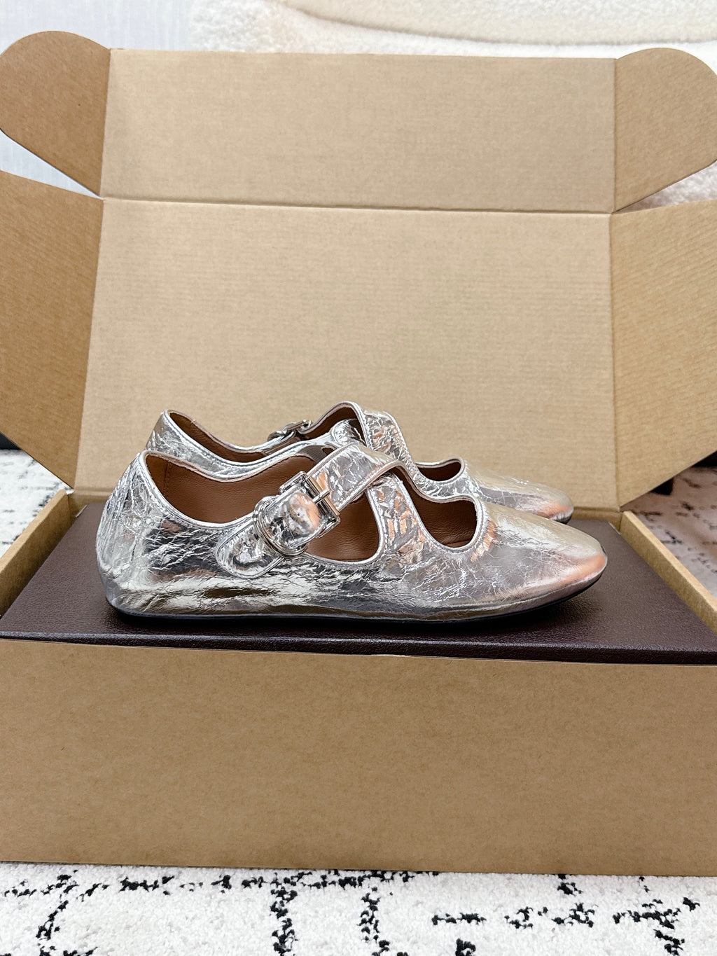 ALAIA 26S CROSS-STRAP BALLET FLATS IN SILVER LAMBSKIN
