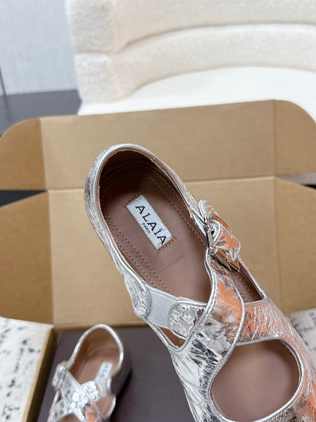 ALAIA 26S CROSS-STRAP BALLET FLATS IN SILVER LAMBSKIN