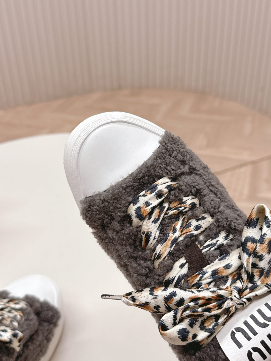 MIUMIU 25S SNEAKERS IN DARK BROWN SHEARLING WITH LEOPARD-PRINT LACES