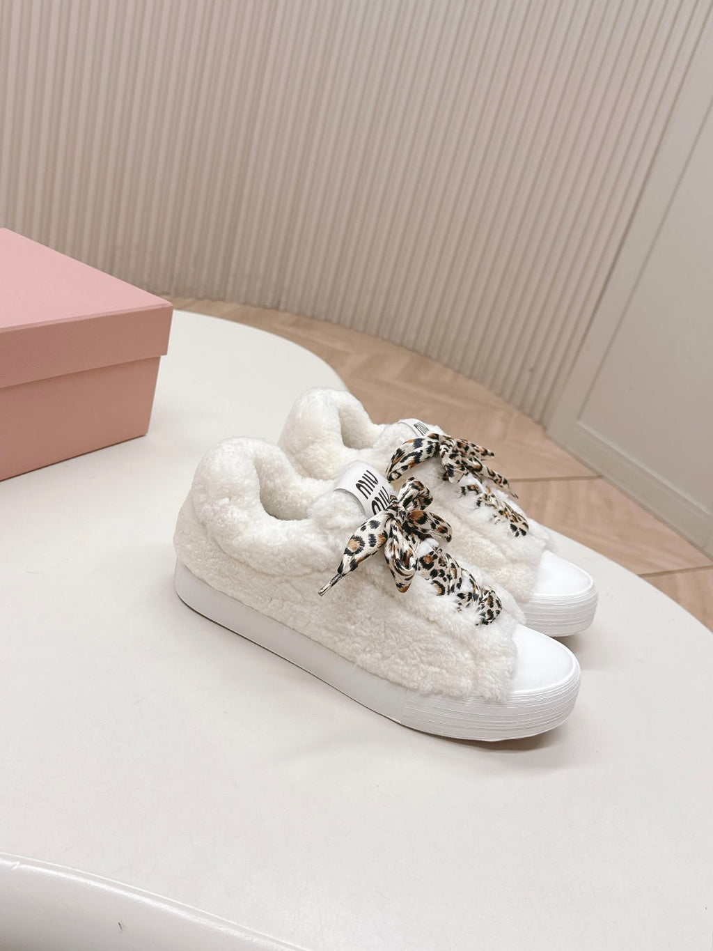 MIUMIU 25S SNEAKERS IN WHITE SHEARLING WITH LEOPARD-PRINT LACES
