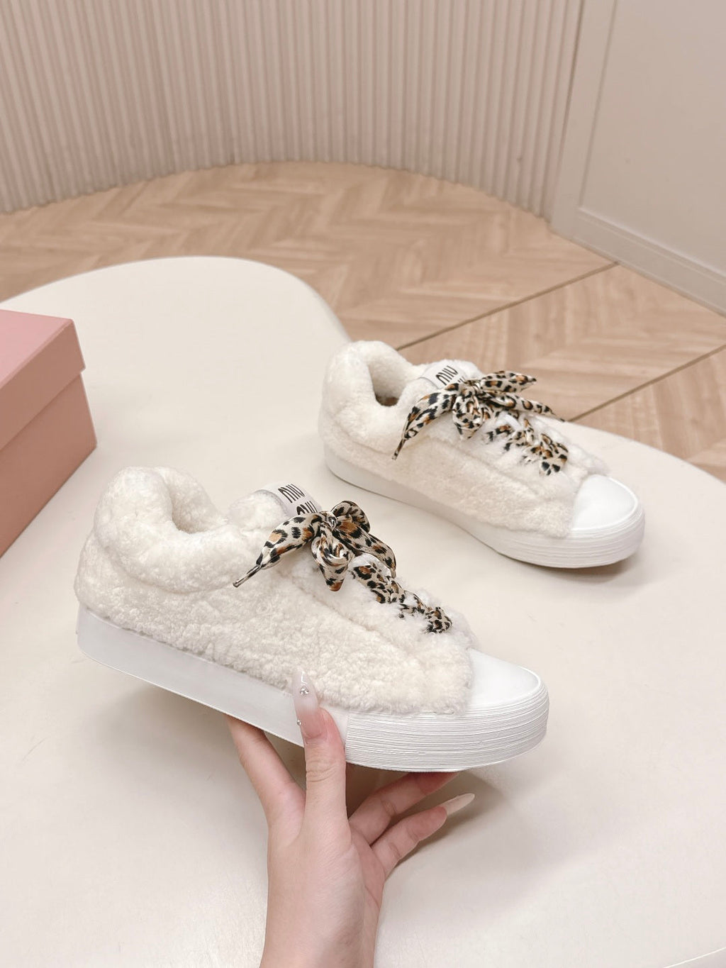 MIUMIU 25S SNEAKERS IN WHITE SHEARLING WITH LEOPARD-PRINT LACES