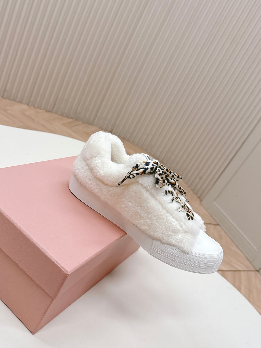 MIUMIU 25S SNEAKERS IN WHITE SHEARLING WITH LEOPARD-PRINT LACES