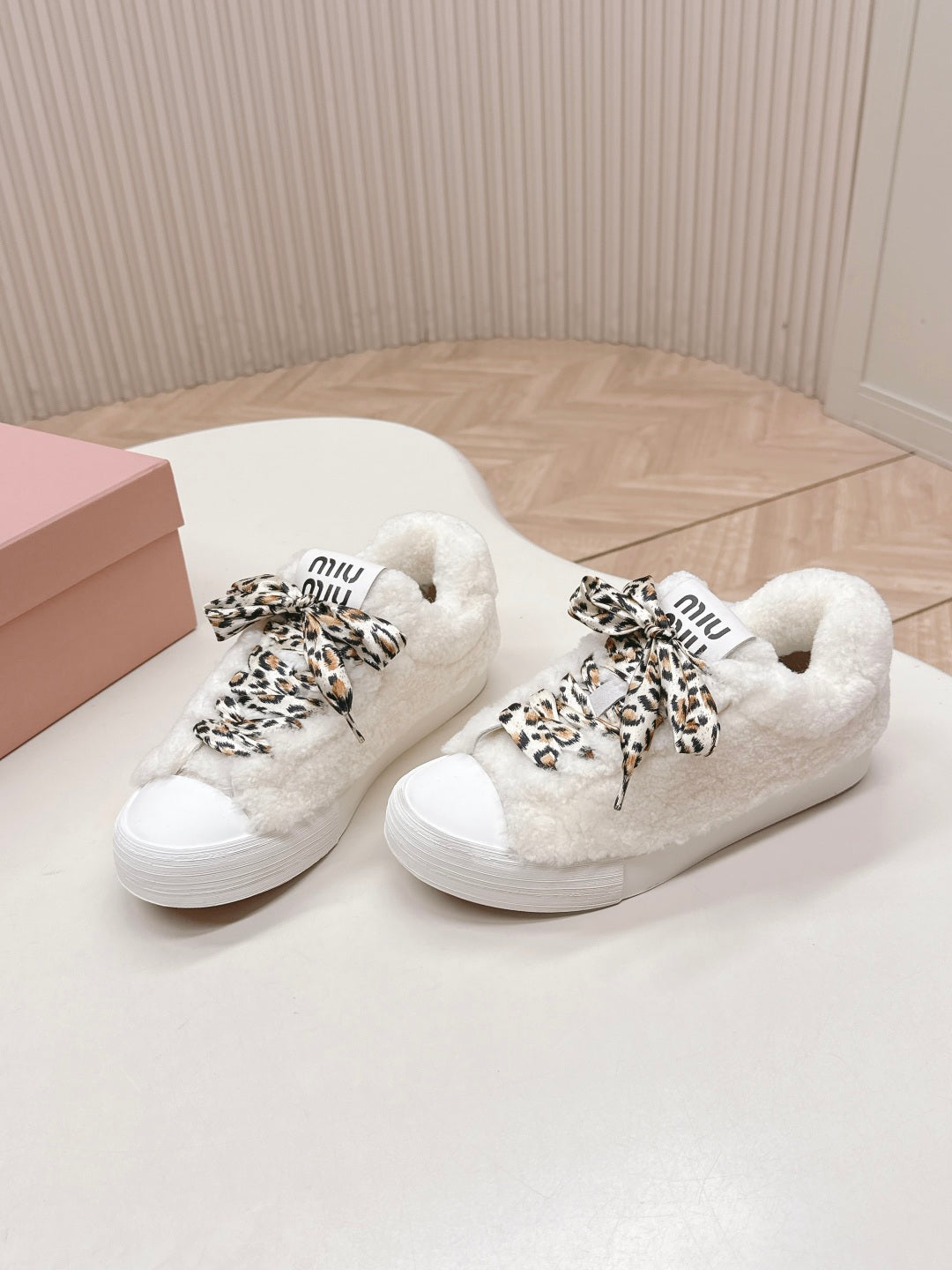 MIUMIU 25S SNEAKERS IN WHITE SHEARLING WITH LEOPARD-PRINT LACES