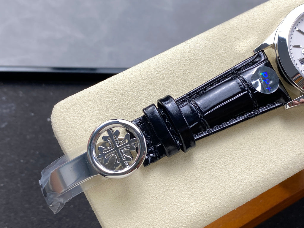 ANNUAL CALENDAR SELF-WINDING WHITE GOLD CASE BROWN BLACK STRAP