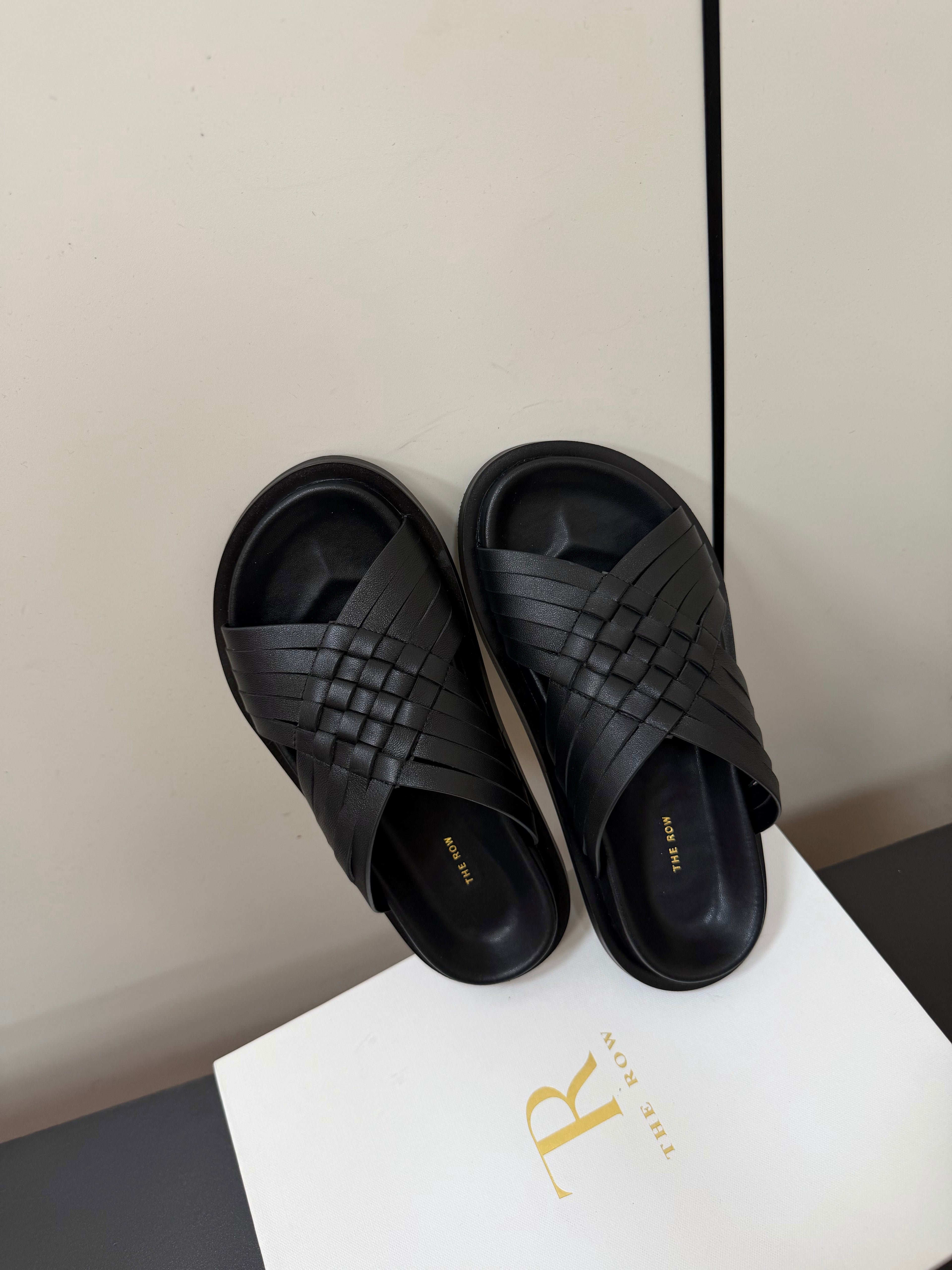 THE ROW 26S CROSS STRAP SANDALS IN BLACK CALFSKIN