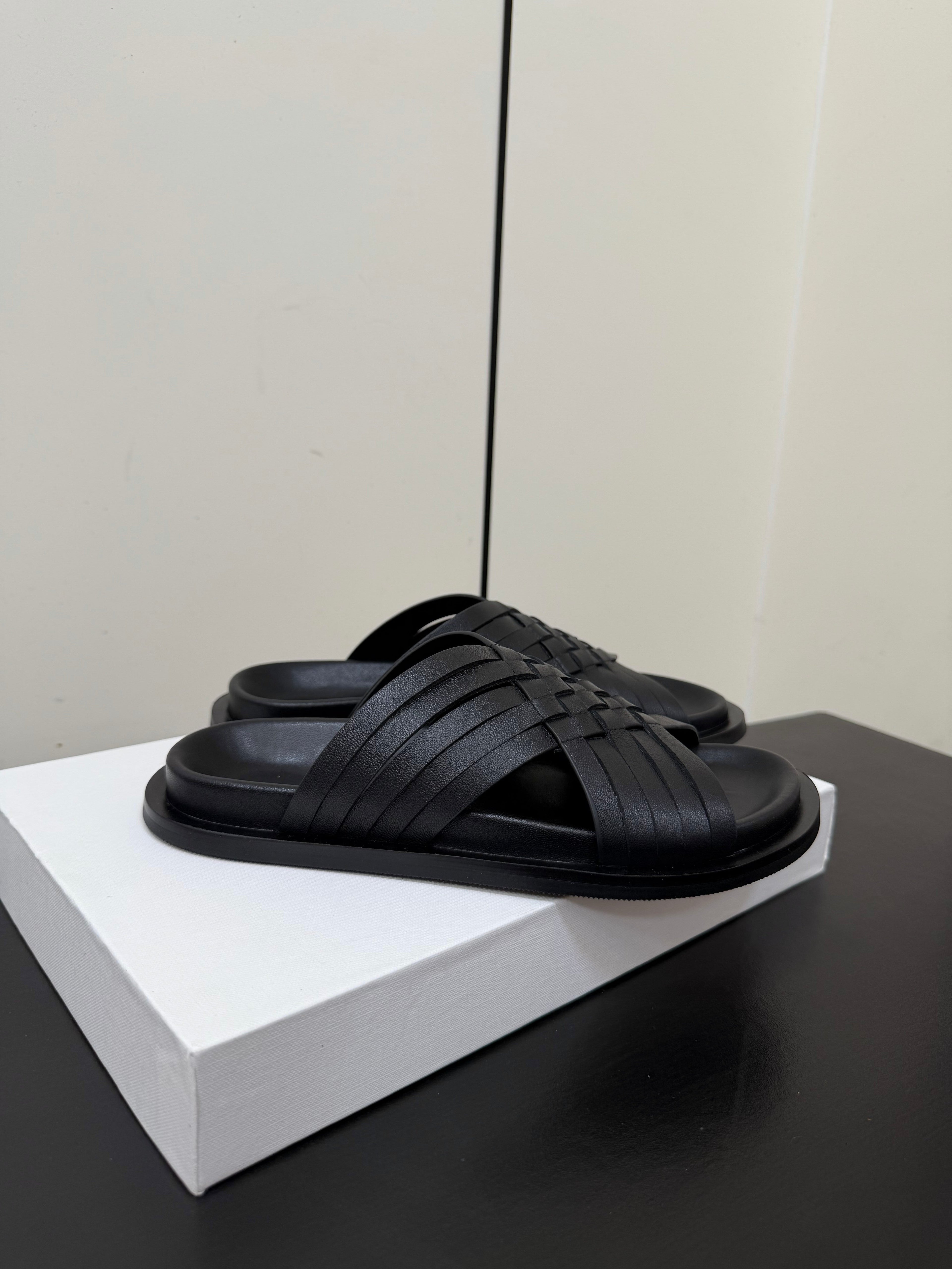 THE ROW 26S CROSS STRAP SANDALS IN BLACK CALFSKIN