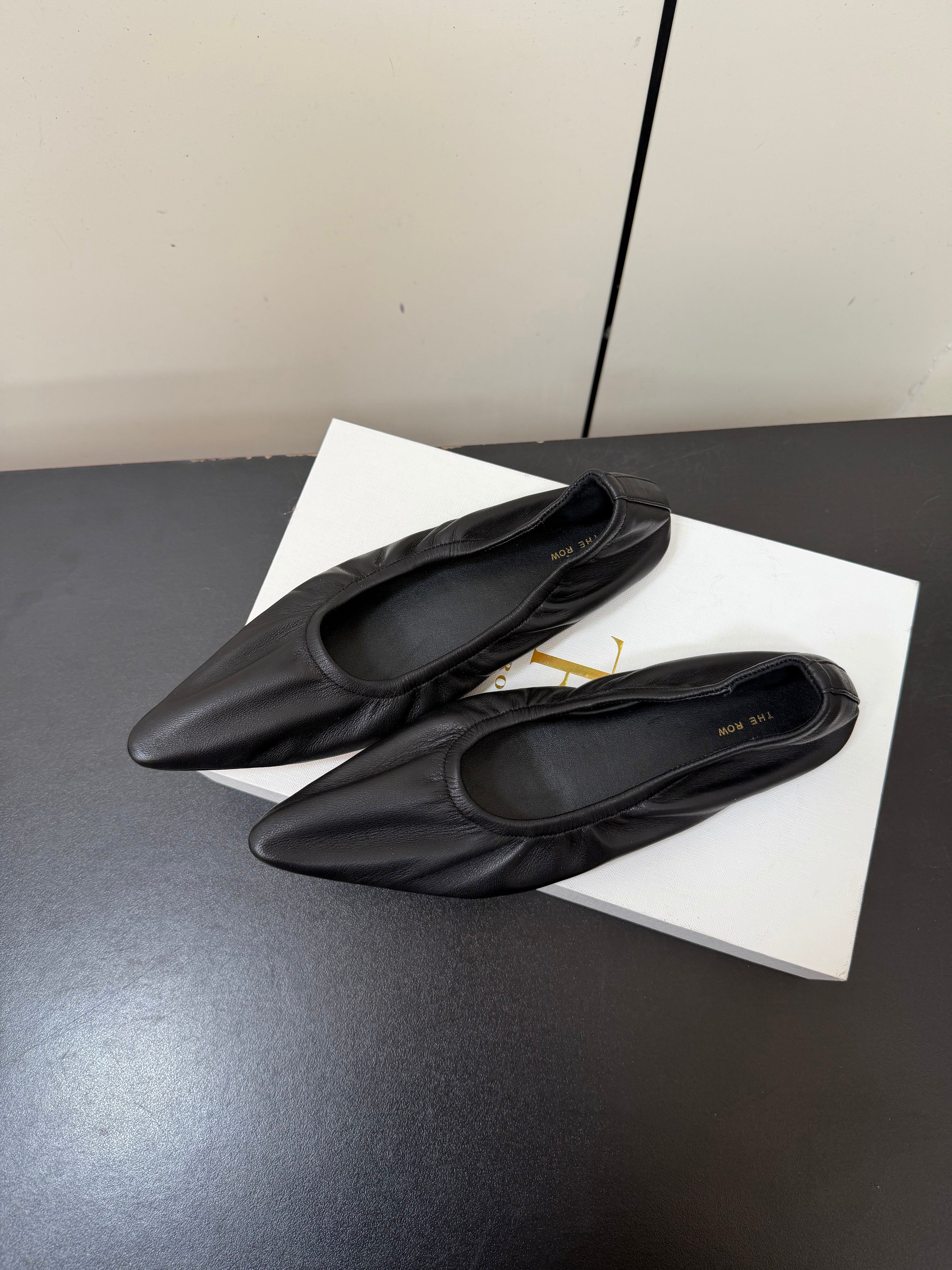 THE ROW 26S POINTED TOE BALLET FLATS IN BLACK LAMBSKIN