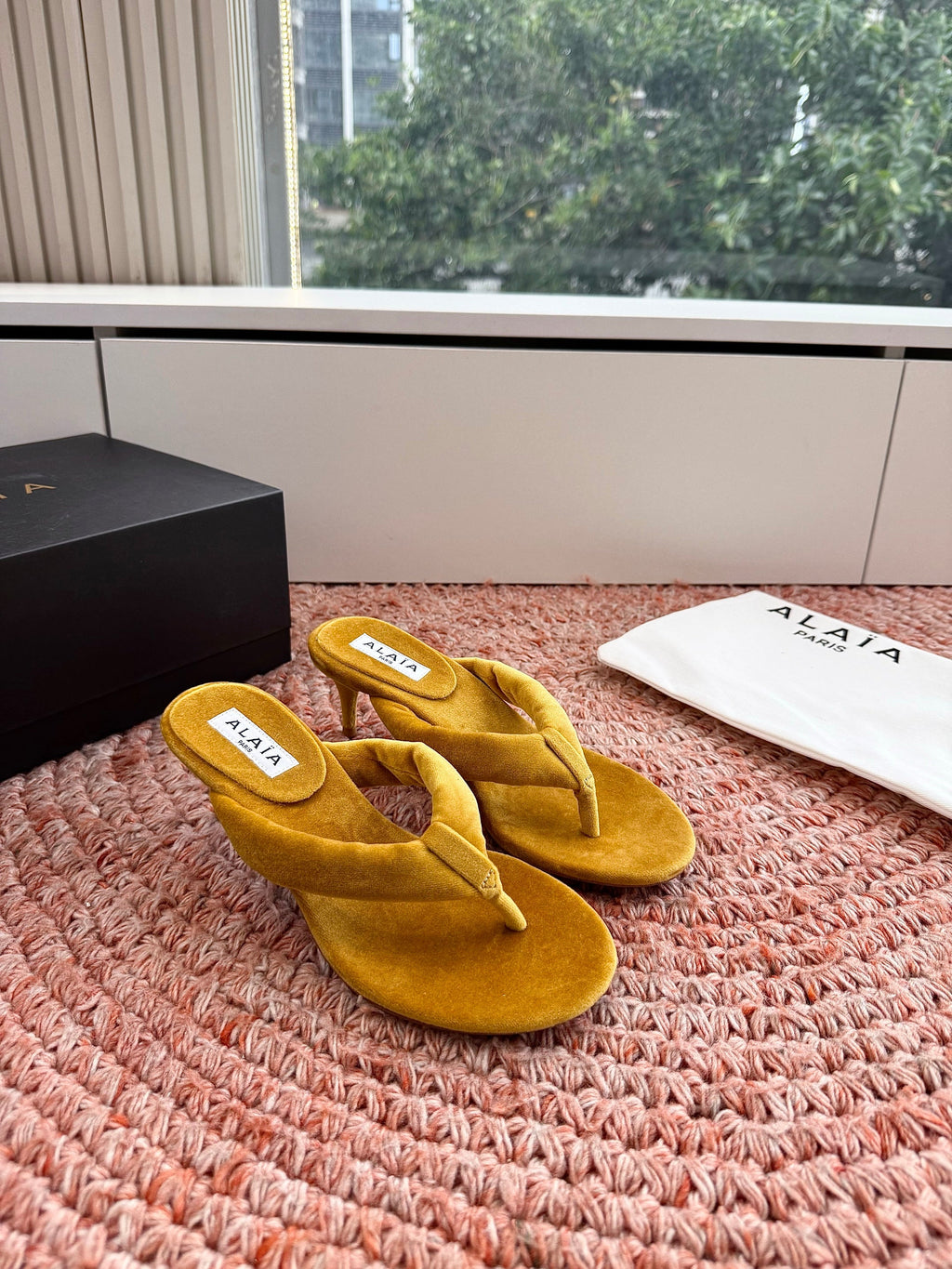 ALAIA 26S HEELED THONG SANDALS IN MUSTARD YELLOW VELVET