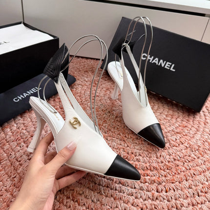 CHANEL 26S POINTED TOE HIGH HEEL SLINGBACKS IN WHITE LAMBSKIN WITH BLACK FLORAL APPLIQUE