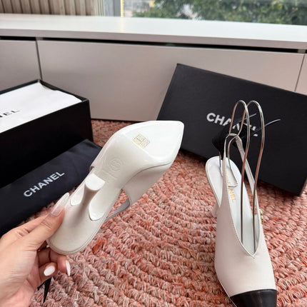CHANEL 26S POINTED TOE HIGH HEEL SLINGBACKS IN WHITE LAMBSKIN WITH BLACK FLORAL APPLIQUE