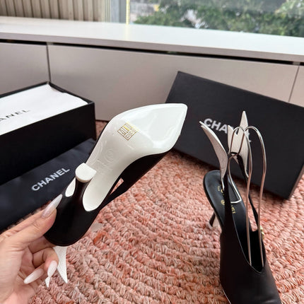 CHANEL 26S POINTED TOE HIGH HEEL SLINGBACKS IN BLACK AND WHITE LAMBSKIN WITH FLORAL APPLIQUE