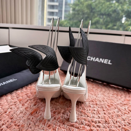 CHANEL 26S POINTED TOE HIGH HEEL SLINGBACKS IN WHITE LAMBSKIN WITH BLACK FLORAL APPLIQUE