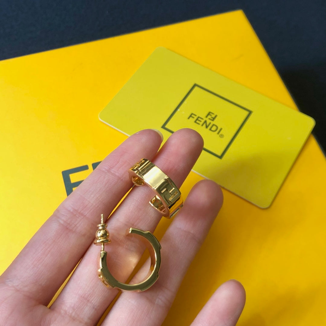FENDI 26S FF LOGO HUGGIE HOOP EARRINGS IN GOLD TONE METAL 635065