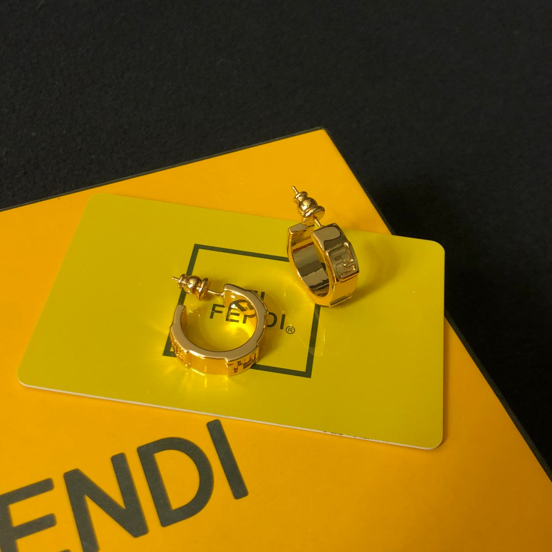 FENDI 26S FF LOGO HUGGIE HOOP EARRINGS IN GOLD TONE METAL 635065