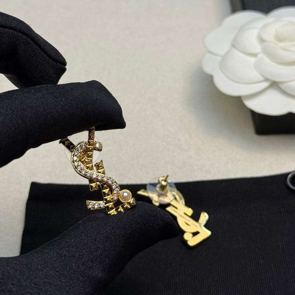 YSL 26S STUDDED CRYSTAL PEARL LOGO EARRINGS IN GOLD TONE METAL 629138