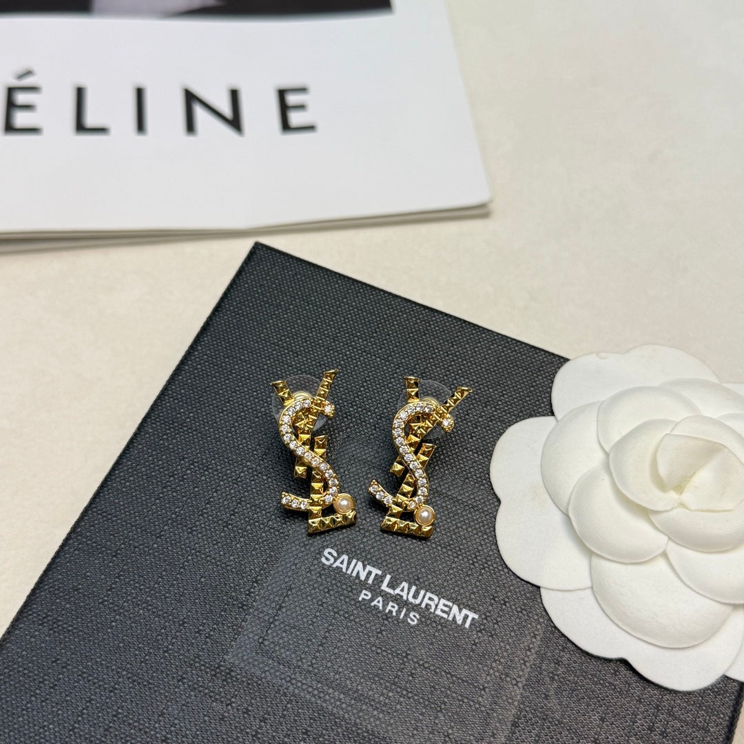 YSL 26S STUDDED CRYSTAL PEARL LOGO EARRINGS IN GOLD TONE METAL 629138