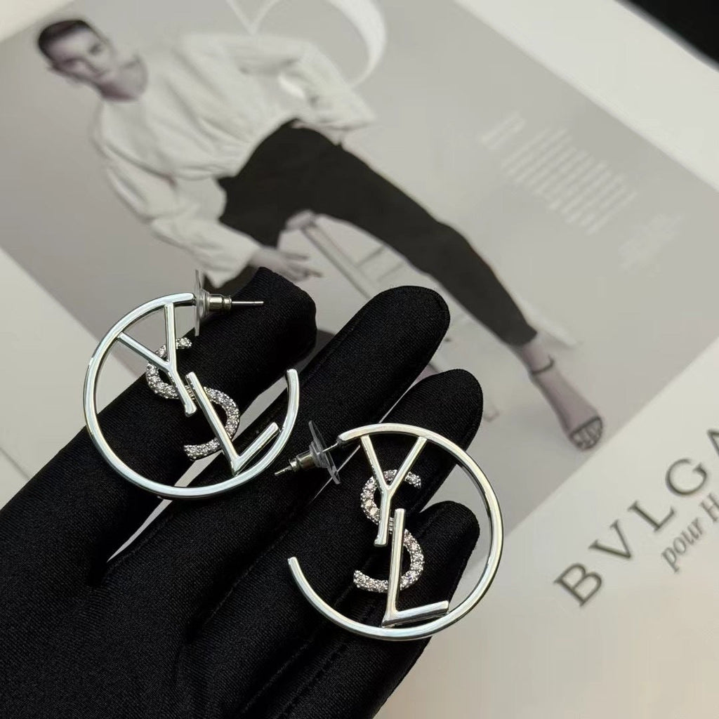 YSL 26S CRYSTAL LOGO HOOP EARRINGS IN SILVER TONE METAL 629137