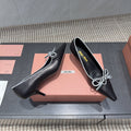 MIUMIU 26S POINTED TOE PUMPS 55MM IN BLACK AND WHITE CALFSKIN WITH BOW