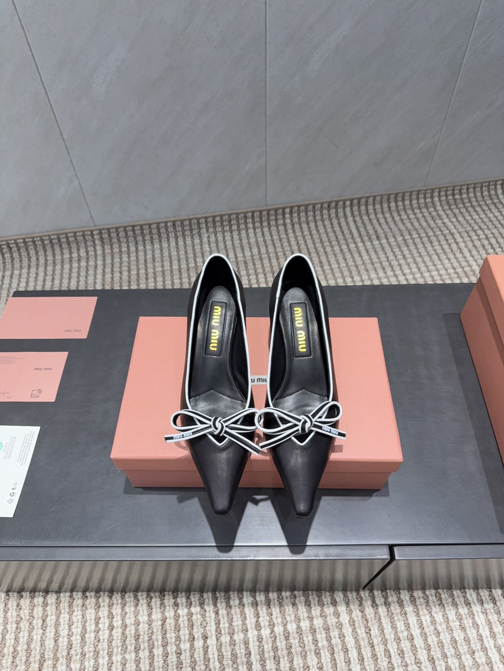 MIUMIU 26S POINTED TOE PUMPS 55MM IN BLACK AND WHITE CALFSKIN WITH BOW