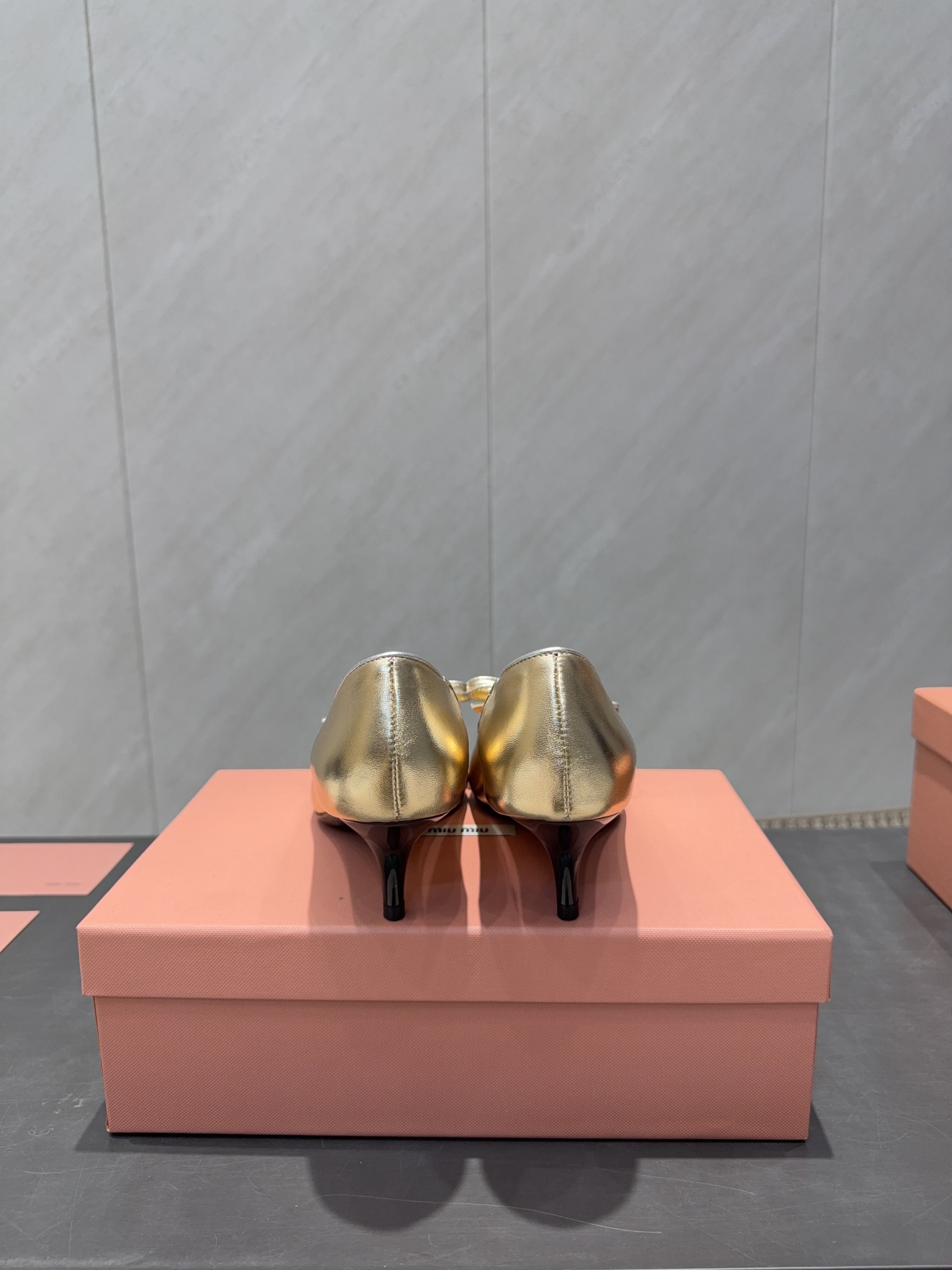 MIUMIU 26S POINTED TOE PUMPS 55MM IN GOLD CALFSKIN WITH BOW