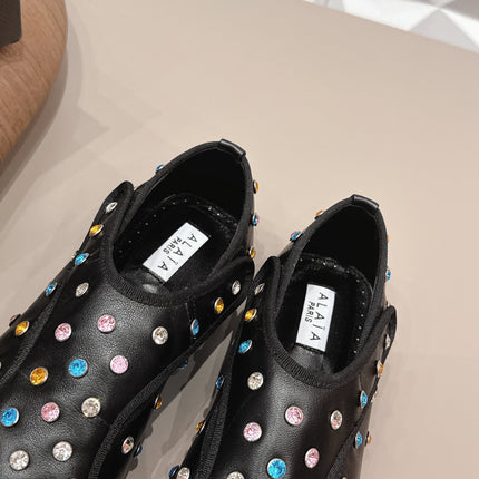 ALAIA 26S EMBELLISHED FLATS IN BLACK LAMBSKIN
