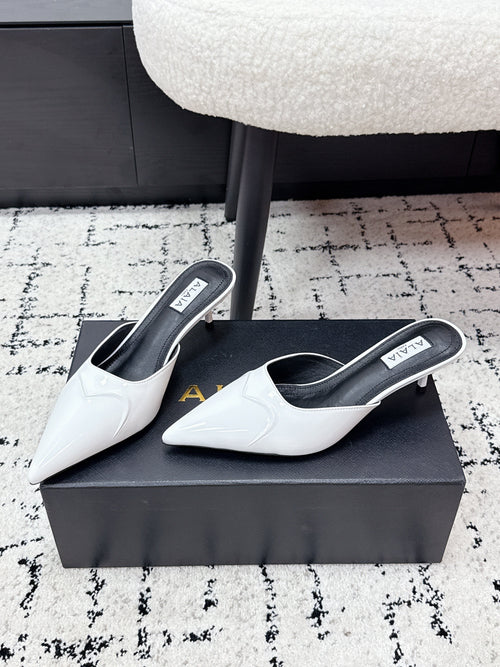 ALAIA 26S HEELED MULES 65 MM IN WHITE GLOSSY CALFSKIN