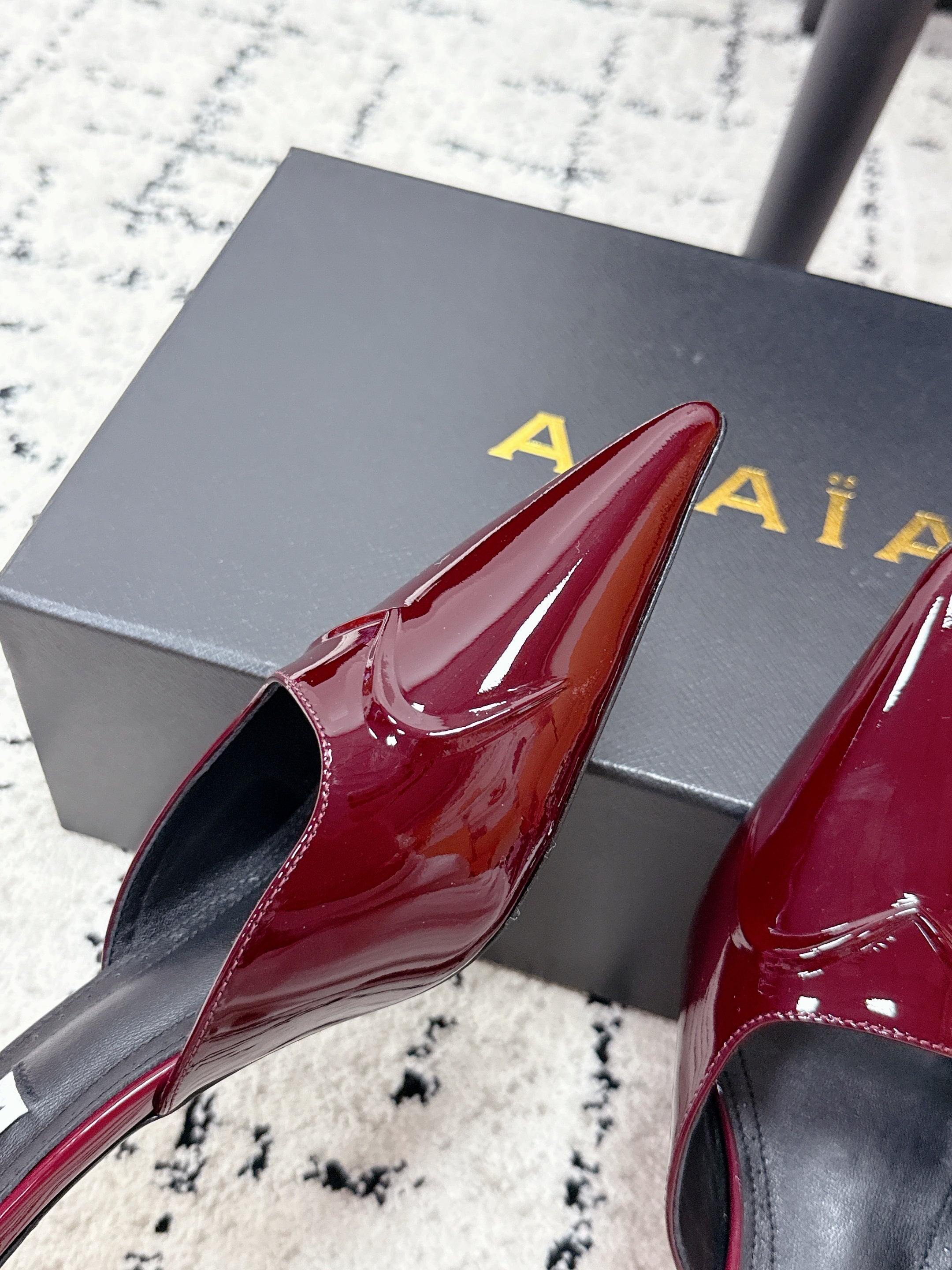 ALAIA 26S HEELED MULES 65 MM IN DARK RED GLOSSY CALFSKIN
