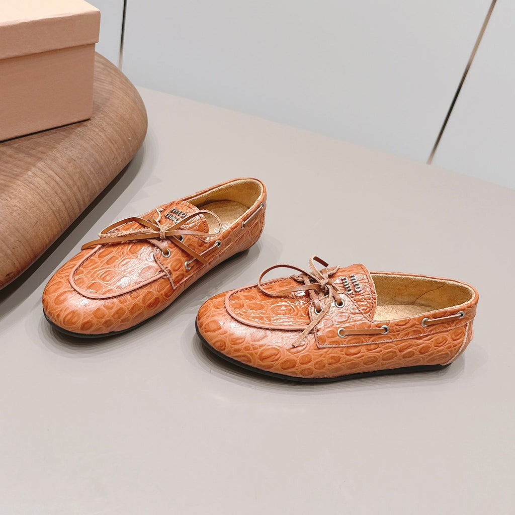 MIUMIU 26S BOAT SHOES IN ORANGE BROWN EMBOSSED CALFSKIN