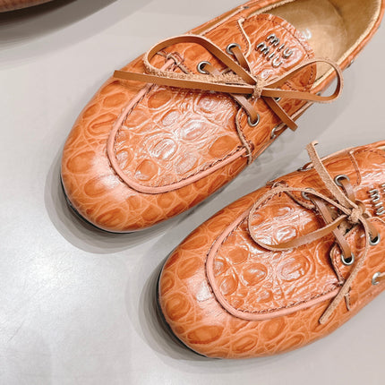 MIUMIU 26S BOAT SHOES IN ORANGE BROWN EMBOSSED CALFSKIN