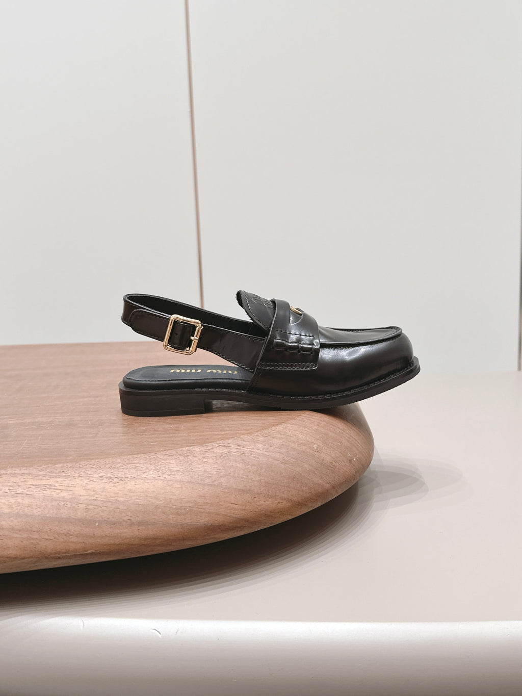 MIUMIU 26S PENNY SLINGBACK LOAFERS IN BLACK CALFSKIN GOLD HARDWARE