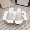LOEWE 26S PETAL ANAGRAM SLIDE IN WHITE CALFSKIN WITH STUDS