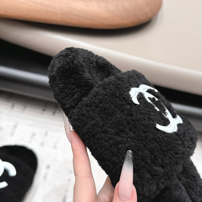 CHANEL 26S SLIDE MULES IN BLACK SHEARLING AND WHITE CC LOGO