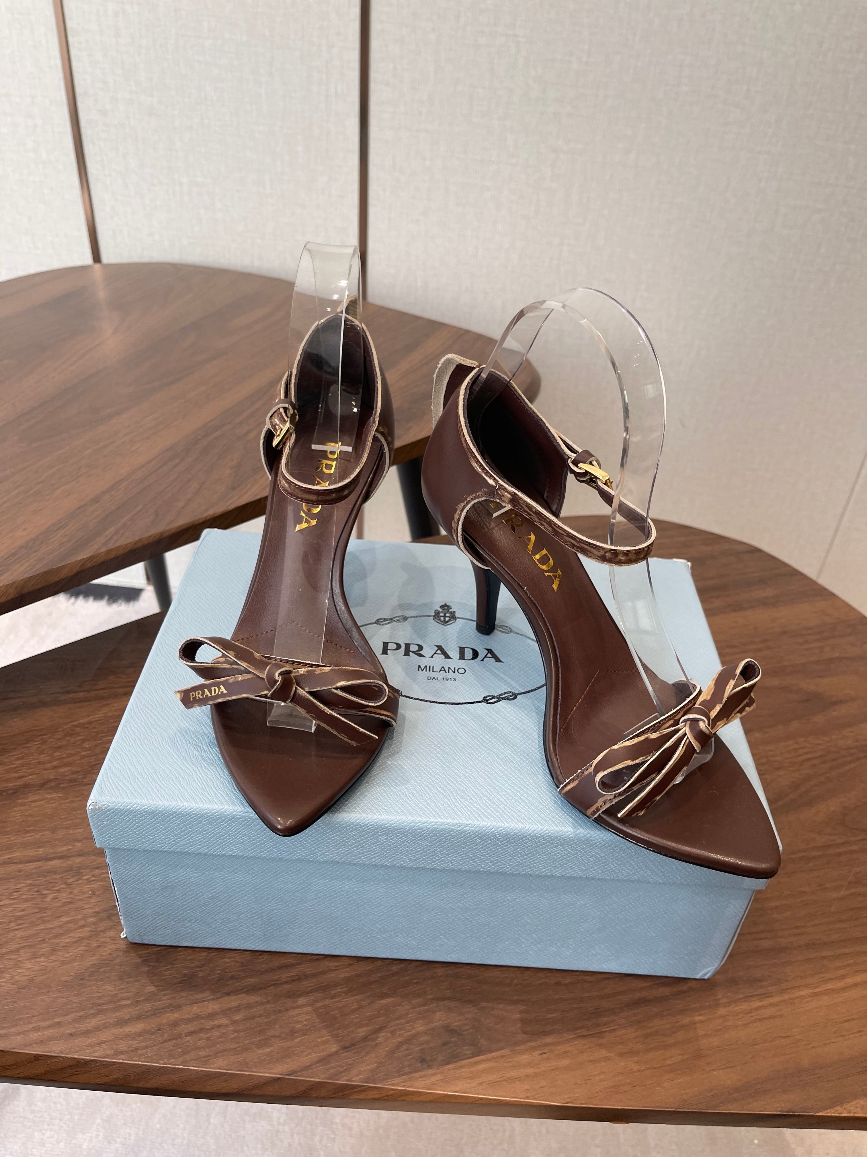 PRADA 26S HIGH HEEL SANDALS 85MM IN CHOCOLATE BROWN CALFSKIN WITH BOW