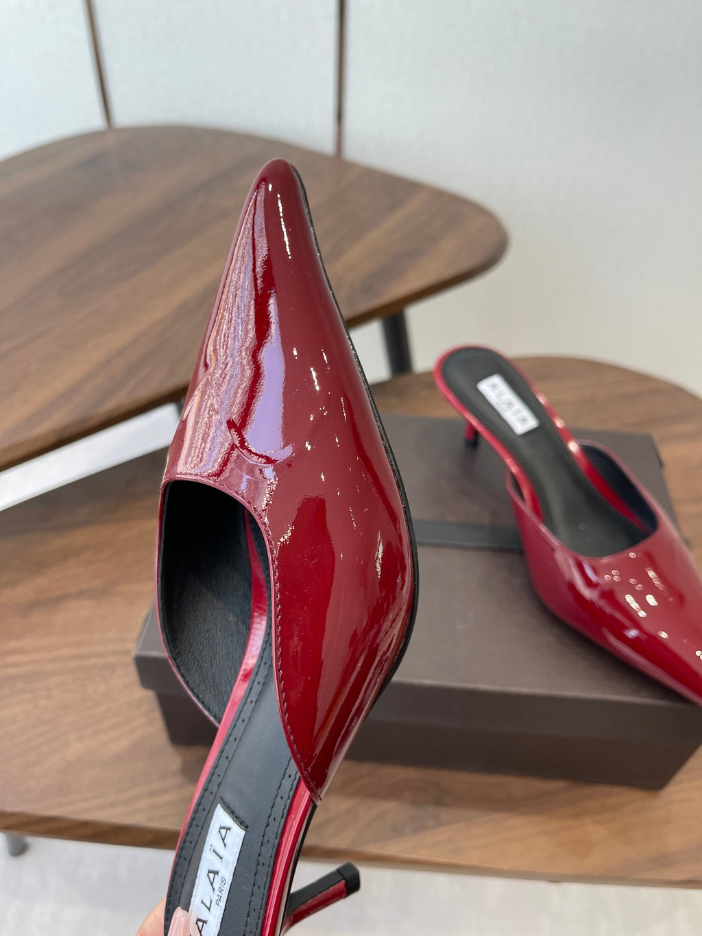 ALAIA 26S HEELED MULES 50 MM IN DARK RED GLOSSY CALFSKIN