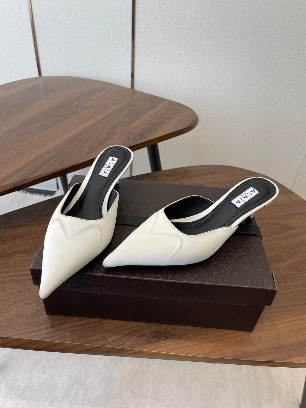 ALAIA 26S HEELED MULES 50 MM IN WHITE FABRIC
