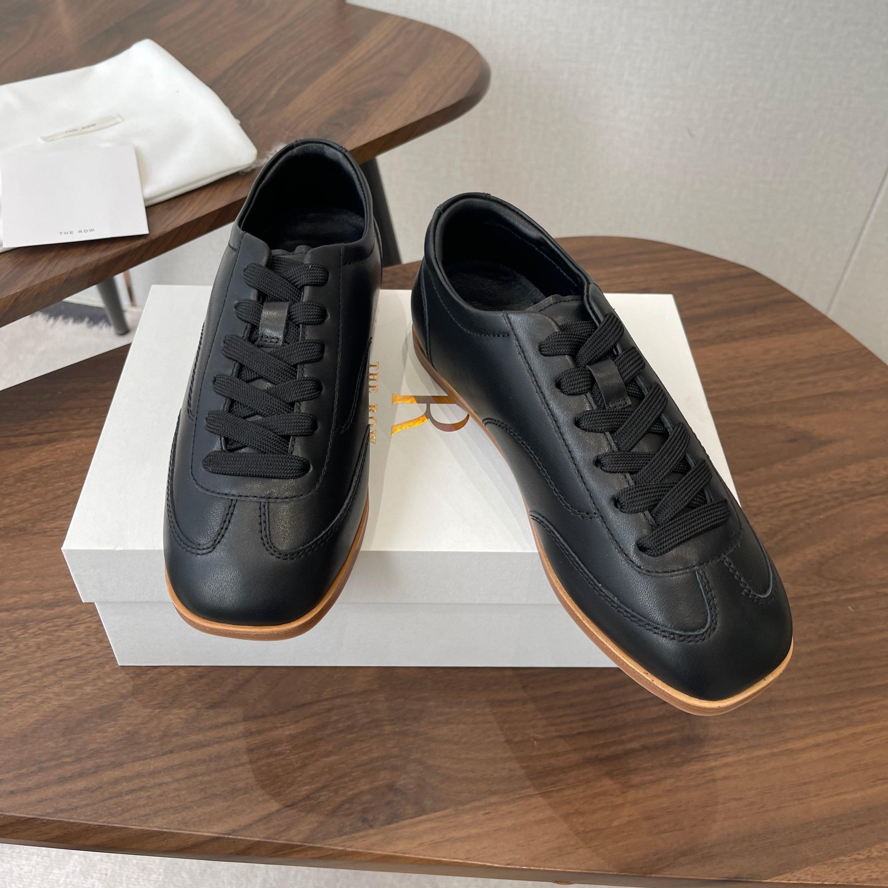 THE ROW 26S SNEAKERS IN BLACK CALFSKIN