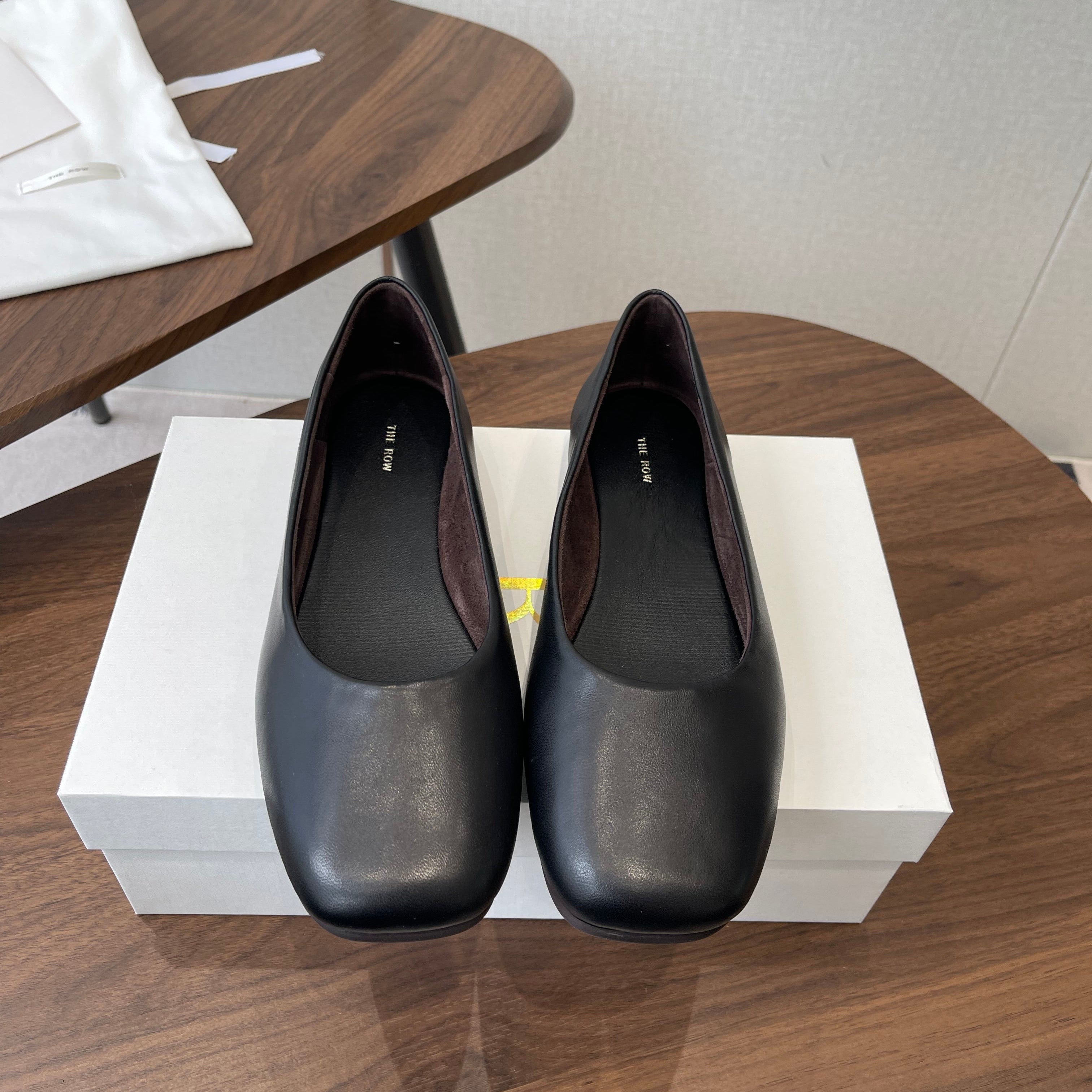 THE ROW 26S FLATS IN BLACK CALFSKIN