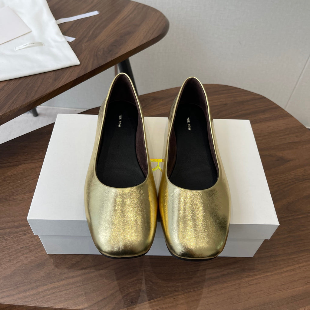 THE ROW 26S FLATS IN GOLD CALFSKIN