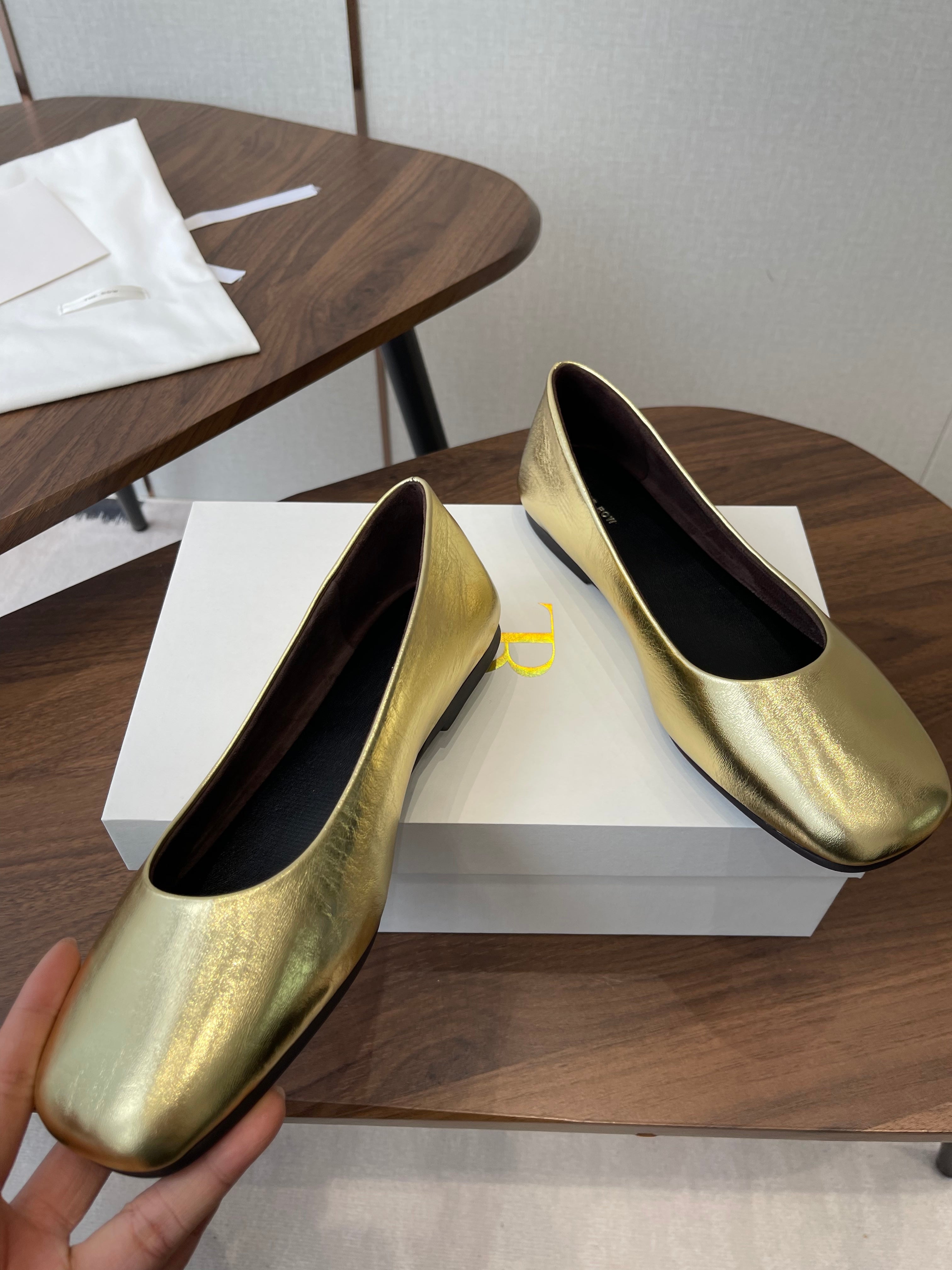 THE ROW 26S FLATS IN GOLD CALFSKIN