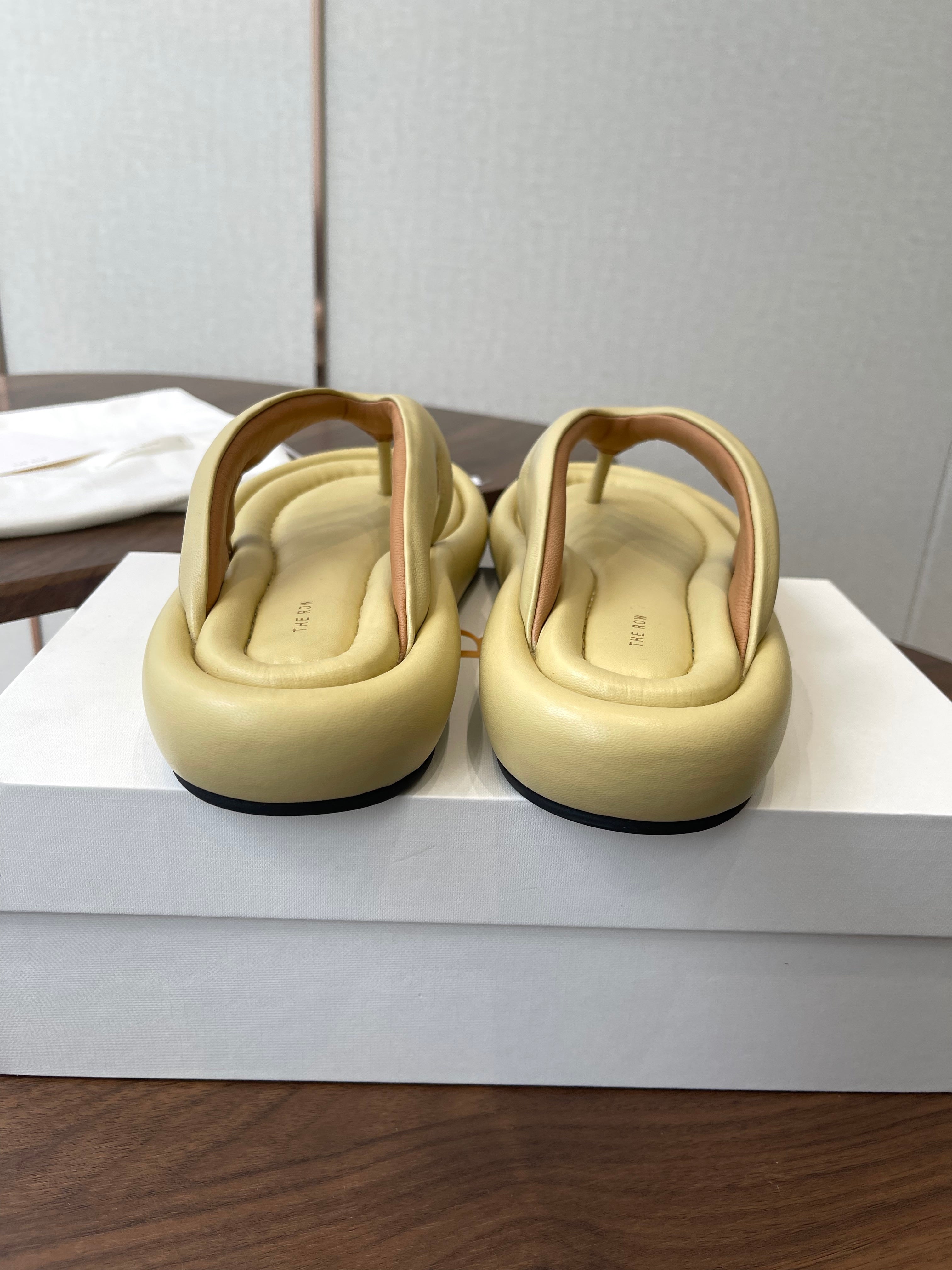 THE ROW 26S PUFFED THONG SANDALS IN BUTTER YELLOW CALFSKIN