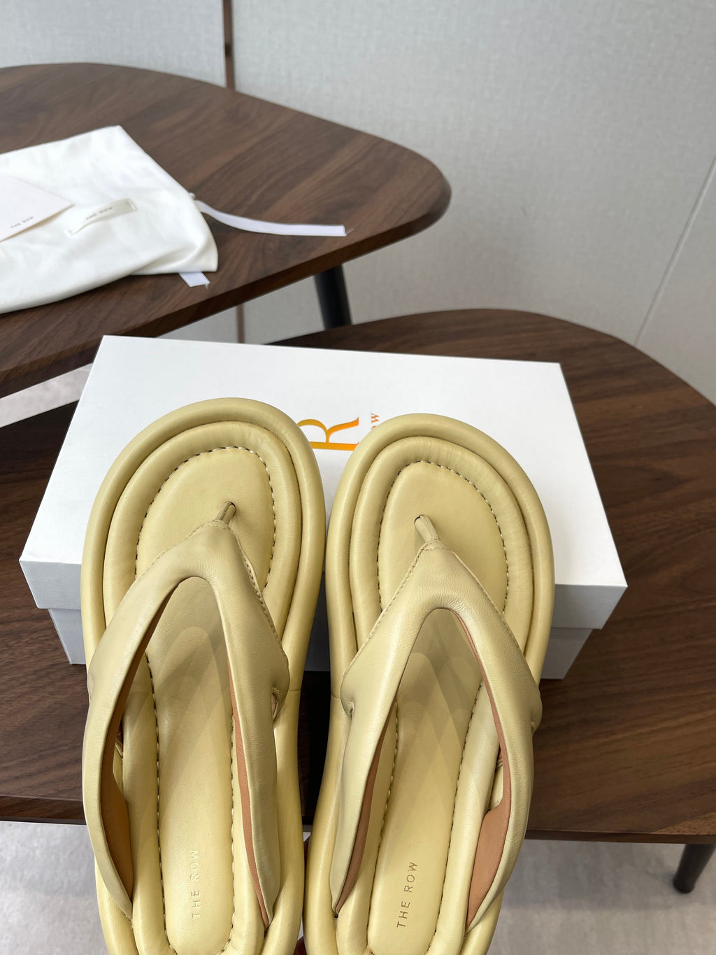 THE ROW 26S PUFFED THONG SANDALS IN BUTTER YELLOW CALFSKIN