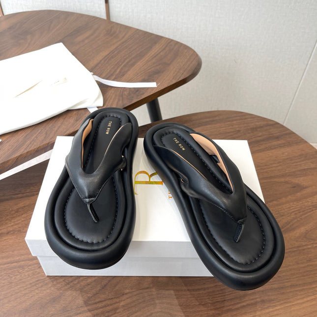 THE ROW 26S PUFFED THONG SANDALS IN BLACK CALFSKIN