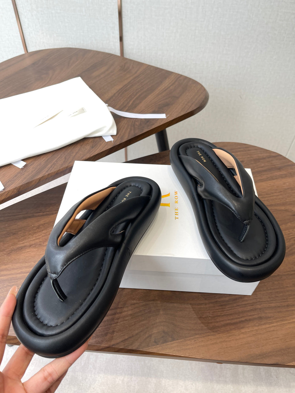 THE ROW 26S PUFFED THONG SANDALS IN BLACK CALFSKIN