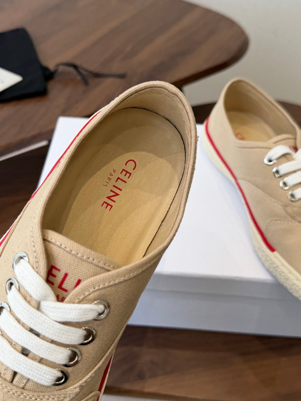 CELINE 26S TRIOMPHE LOW TOP SNEAKERS IN BEIGE CANVAS RED TRIM