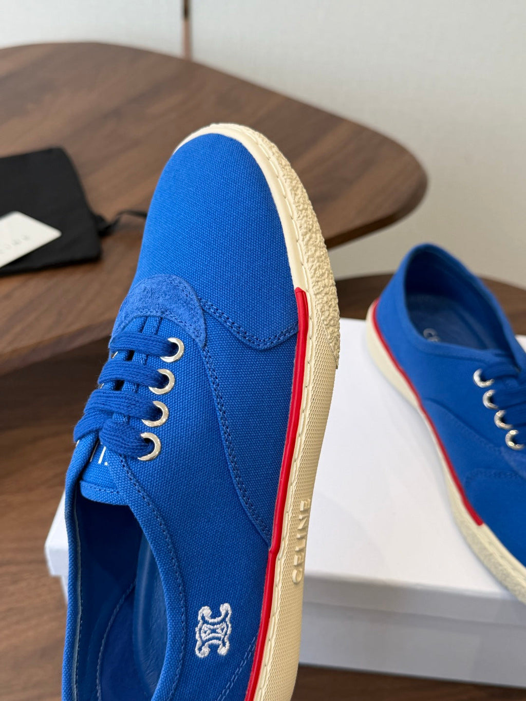 CELINE 26S TRIOMPHE LOW TOP SNEAKERS IN BLUE CANVAS RED TRIM