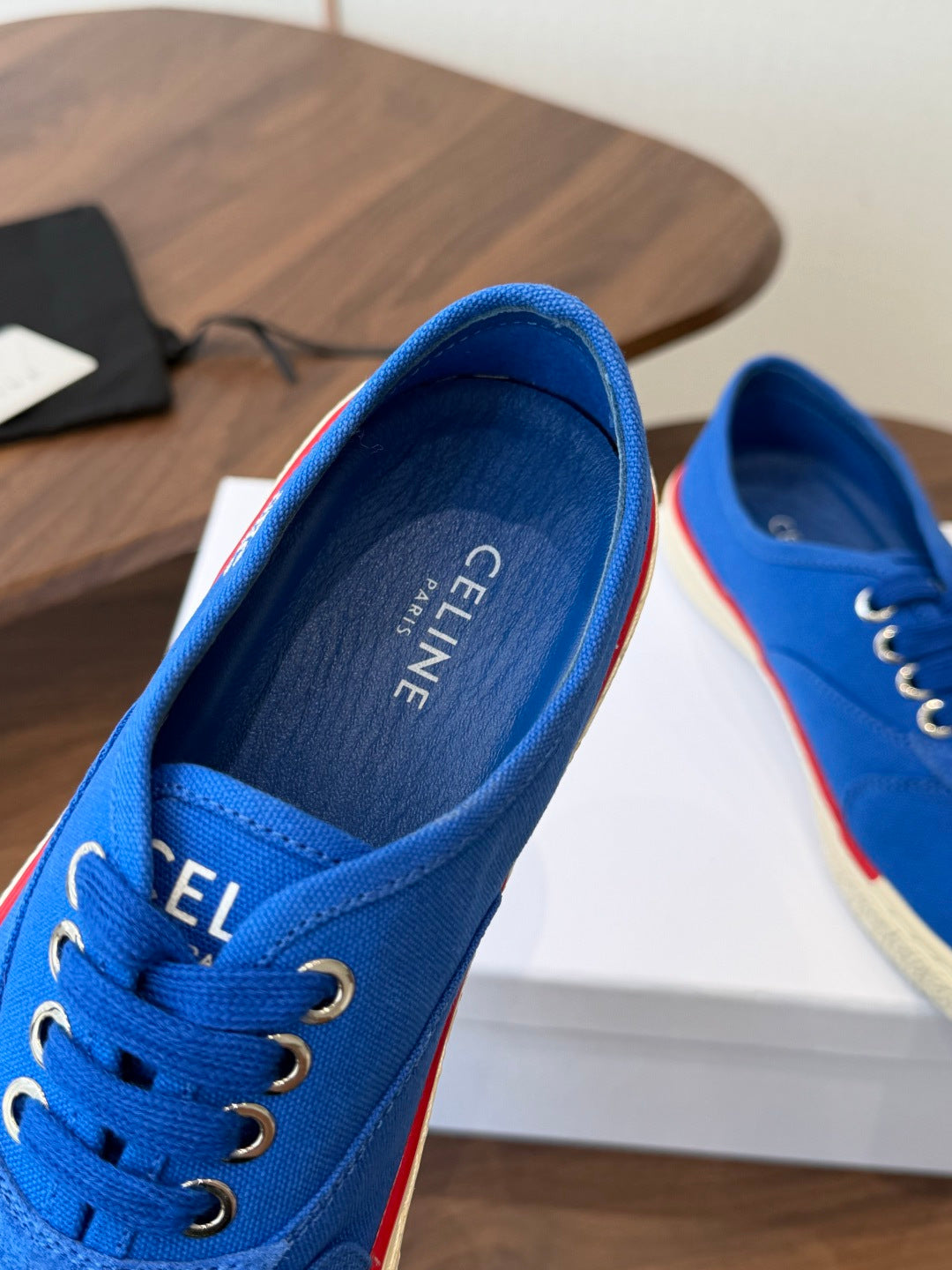 CELINE 26S TRIOMPHE LOW TOP SNEAKERS IN BLUE CANVAS RED TRIM