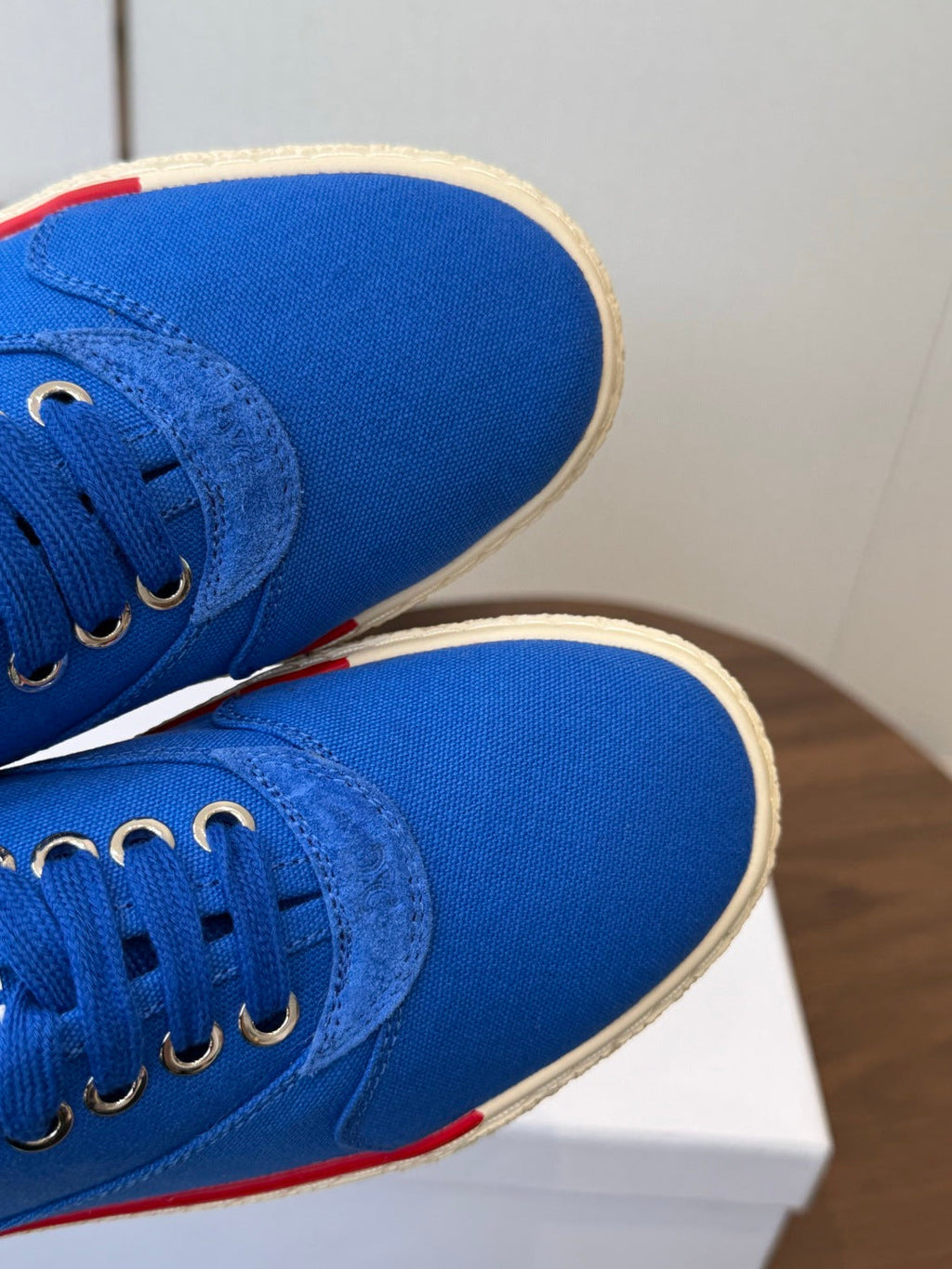 CELINE 26S TRIOMPHE LOW TOP SNEAKERS IN BLUE CANVAS RED TRIM